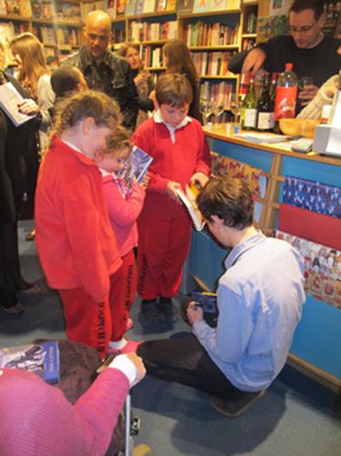 Sam Gayton signing copies of the Snow Merchant